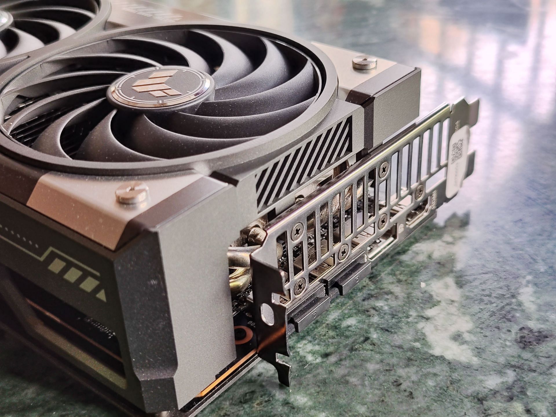 The ASUS TUF Gaming variant is a large 3-slot graphics card (Image via Sportskeeda)